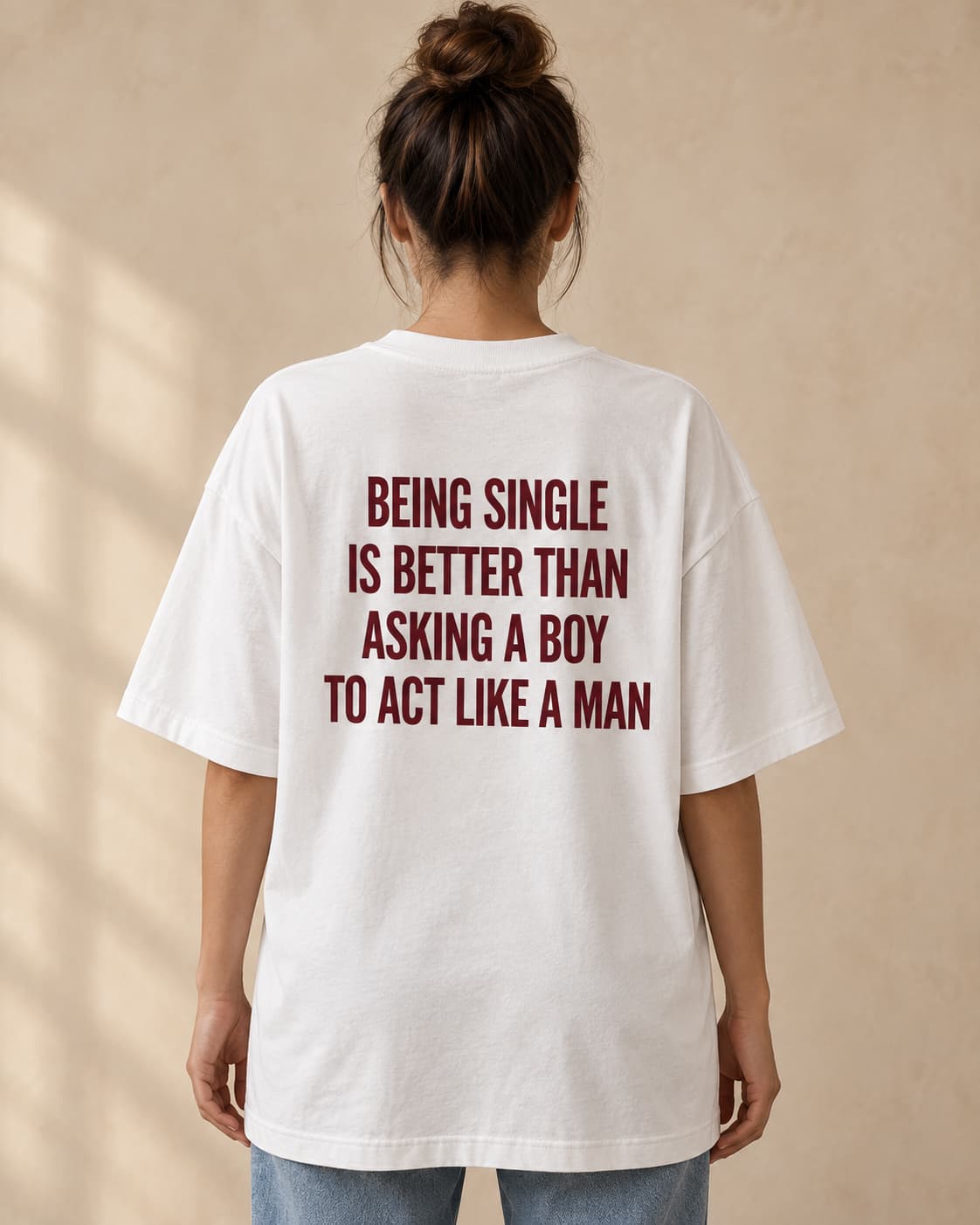 Oversized Tee in white. Caption reads: BEING SINGLE IS BETTER THAN ASKING A BOY TO ACT LIKE A MAN