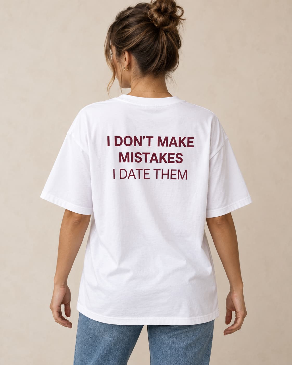 Oversized Tee in white. Caption reads: I DON'T MAKE MISTAKES I DATE THEM