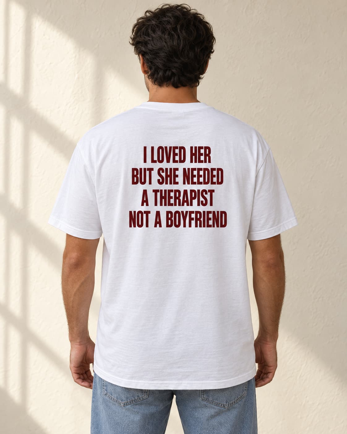 Oversized Tee in white. Caption reads: I LOVED HER BUT SHE NEEDED A THERAPIST NOT A BOYFRIEND
