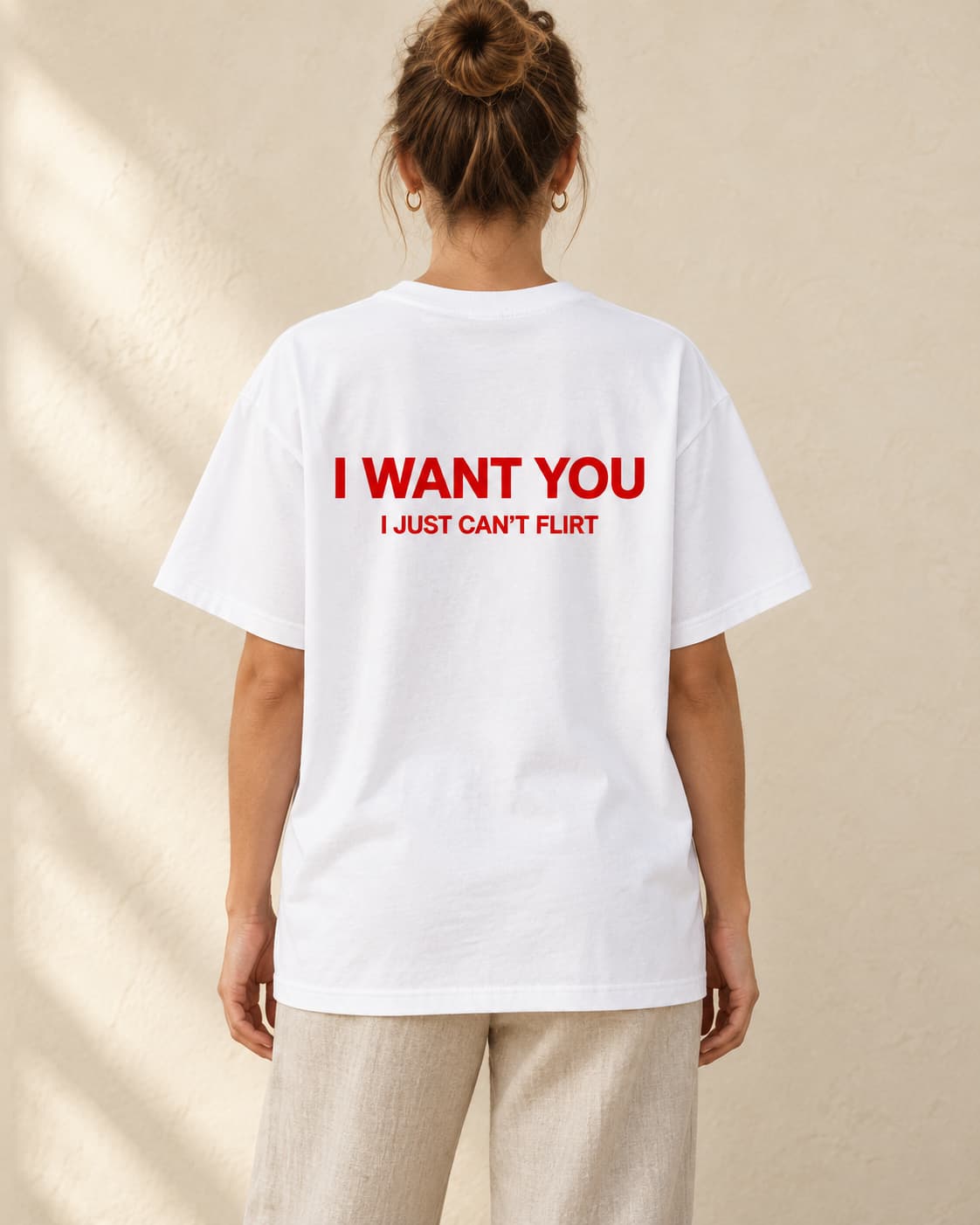 Oversized Tee in white. Caption reads: I WANT YOU I JUST CAN'T FLIRT