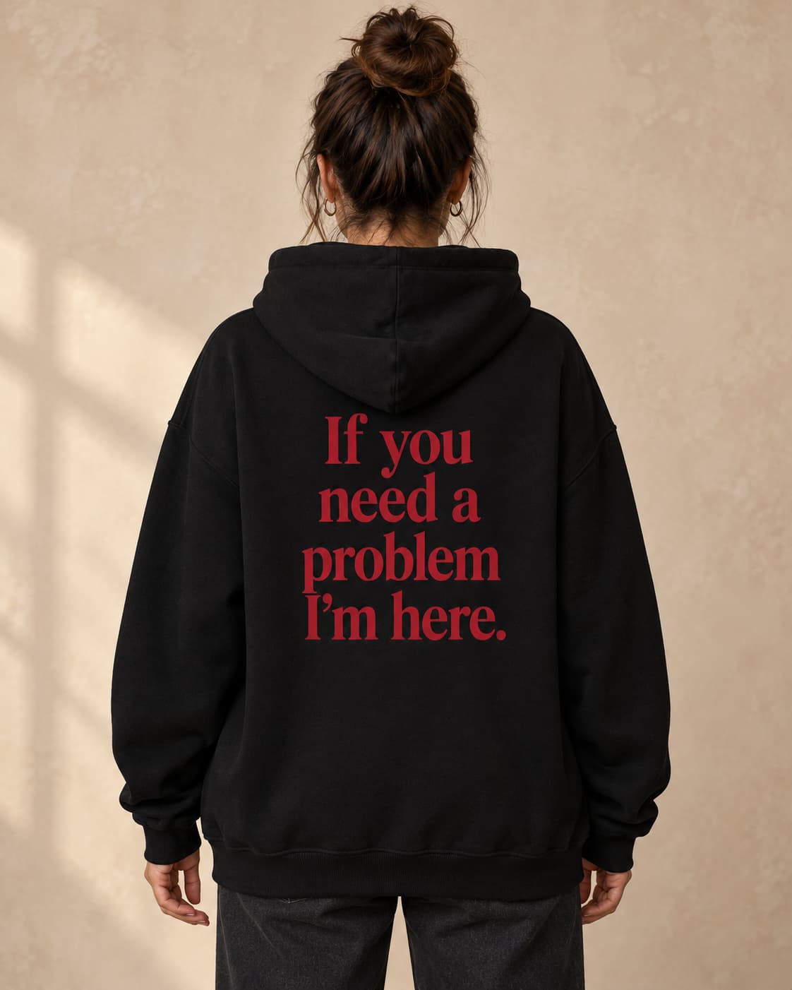 Hoodie in black. Caption reads: If you need a problem I’m here.