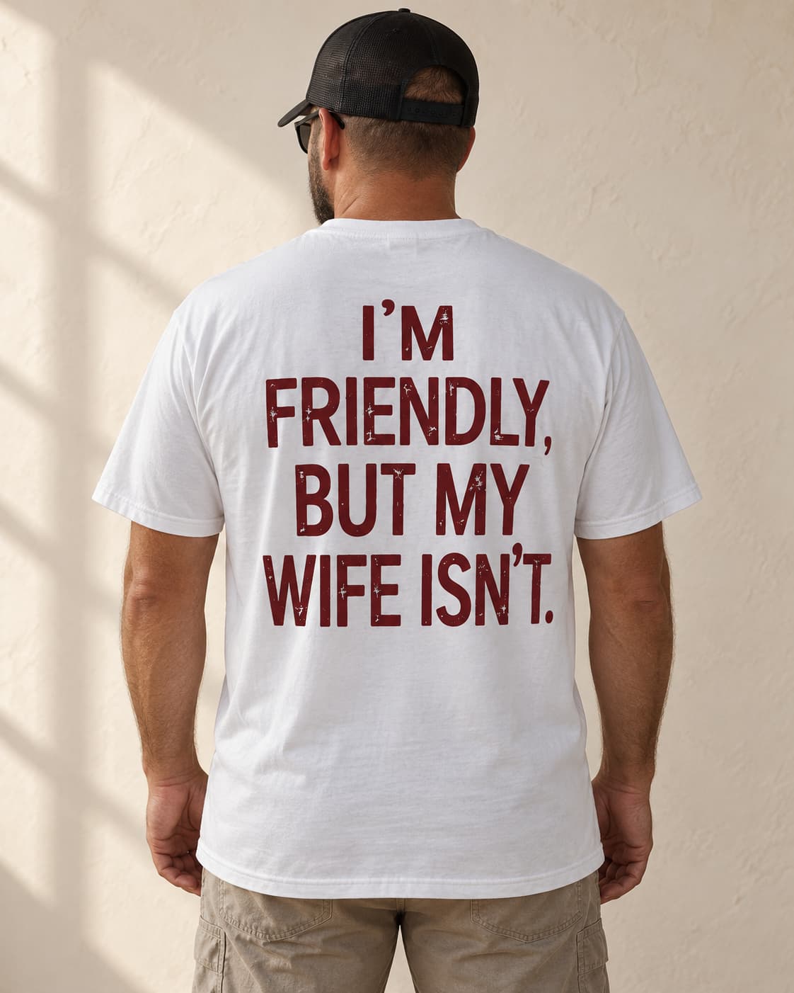 Oversized Tee in white. Caption reads: I'M FRIENDLY, BUT MY WIFE ISN'T.