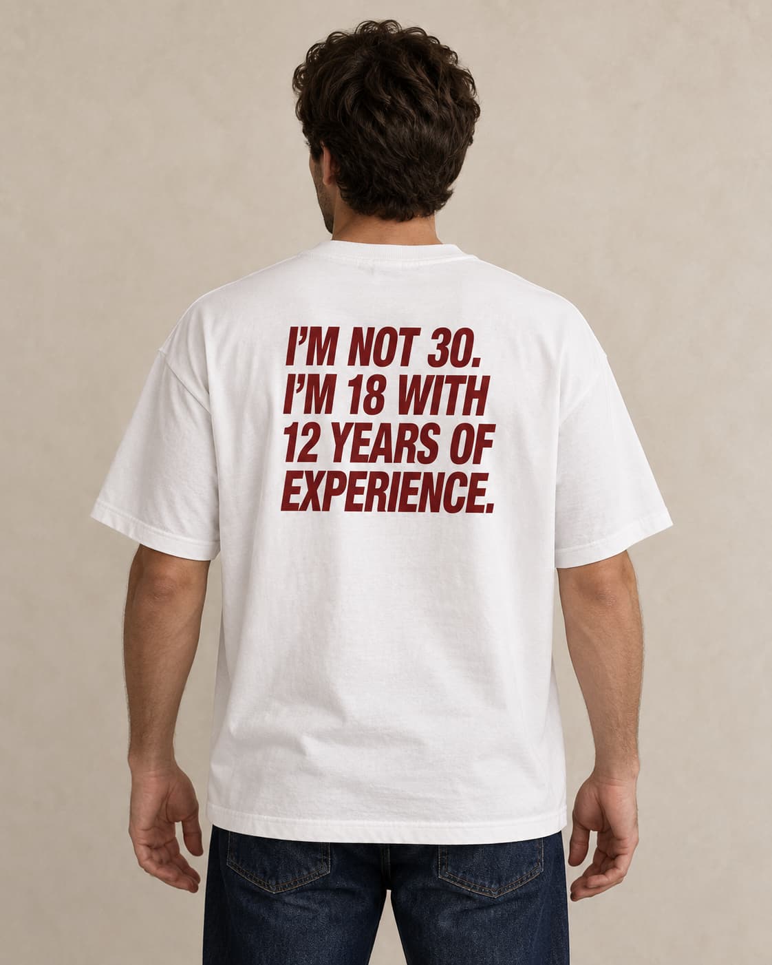 Oversized Tee in white. Caption reads: I'M NOT 30. I'M 18 WITH 12 YEARS OF EXPERIENCE.