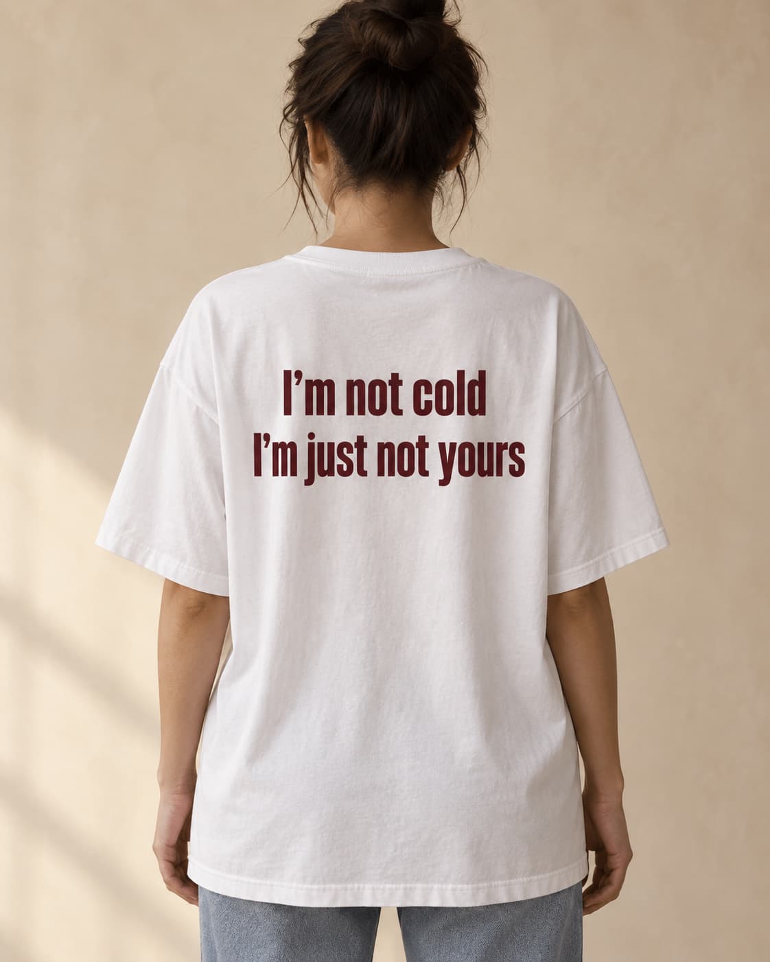Oversized Tee in white. Caption reads: I’m not cold I’m just not yours