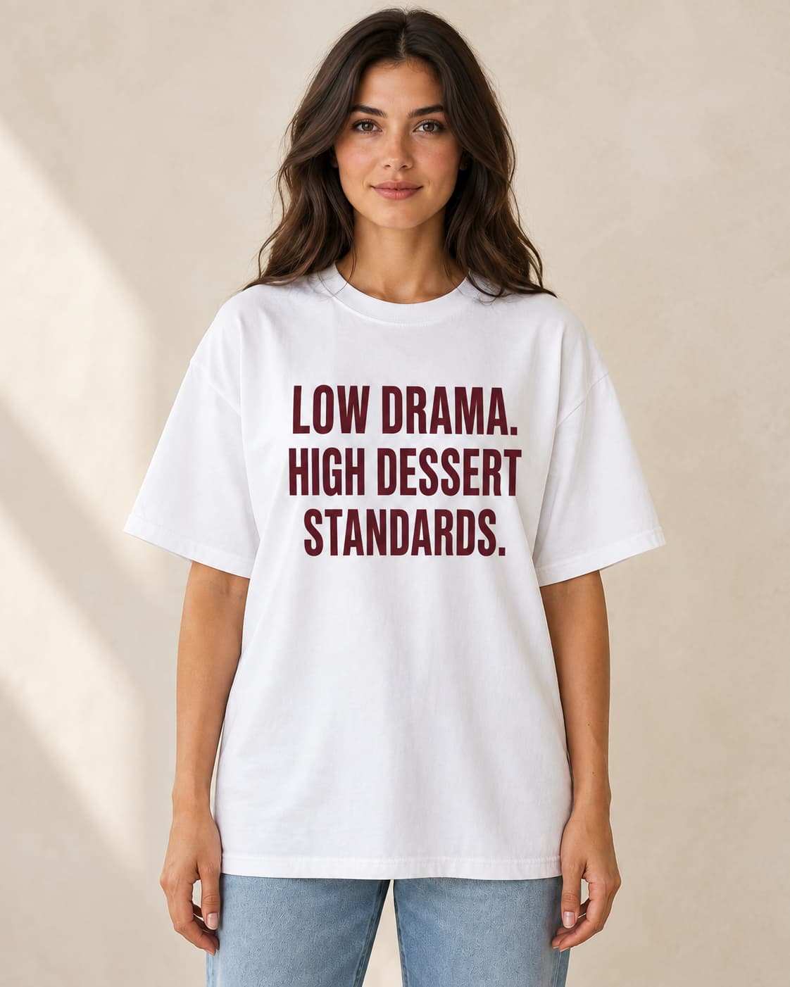 Oversized Tee in white. Caption reads: Low Drama. High Dessert Standards.