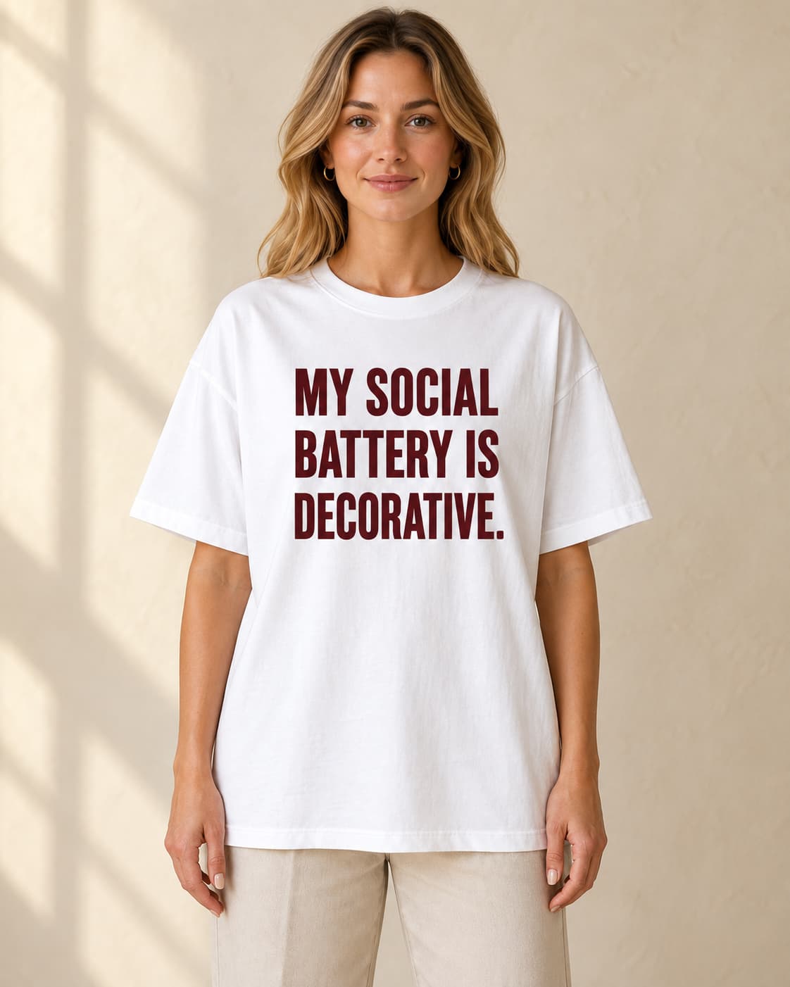 Oversized Tee in white. Caption reads: My Social Battery Is Decorative.