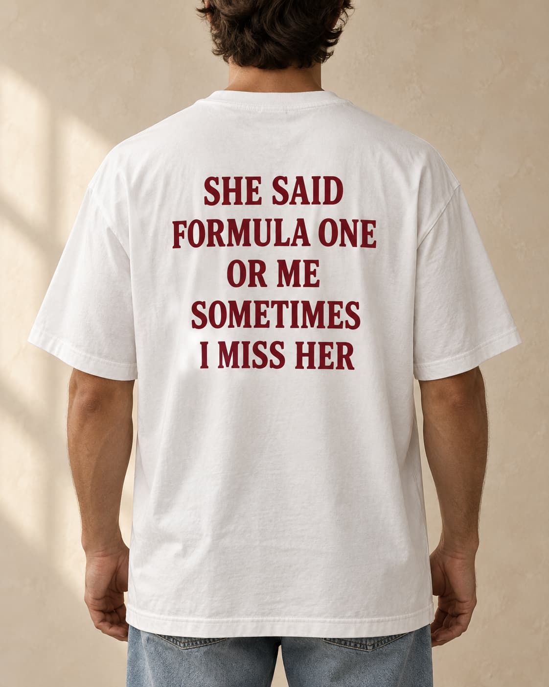Oversized Tee in white. Caption reads: SHE SAID FORMULA ONE OR ME SOMETIMES I MISS HER